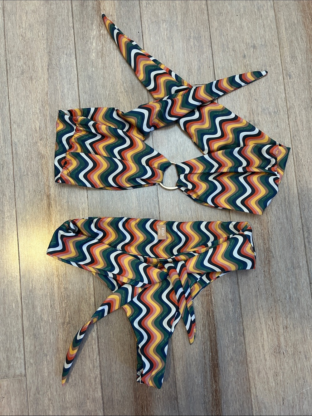 70s-inspired two-piece swimsuit is from the brand NUA Swim Chevron tie back